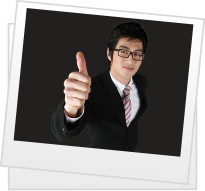 Suited man gives thumbs up