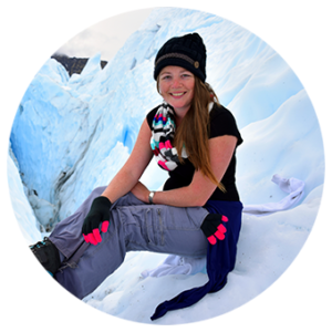 Megan Jerrard from Mapping Megan sitting on a glacier in Alaska 